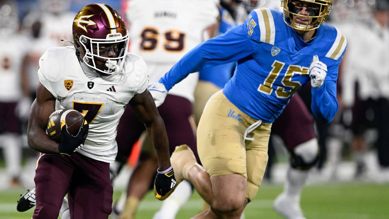 Arizona State Sun Devils wide receiver Melquan Stovall (7) runs against UCLA Bruins defensive lineman Laiatu Latu (15) at the Rose Bowl.