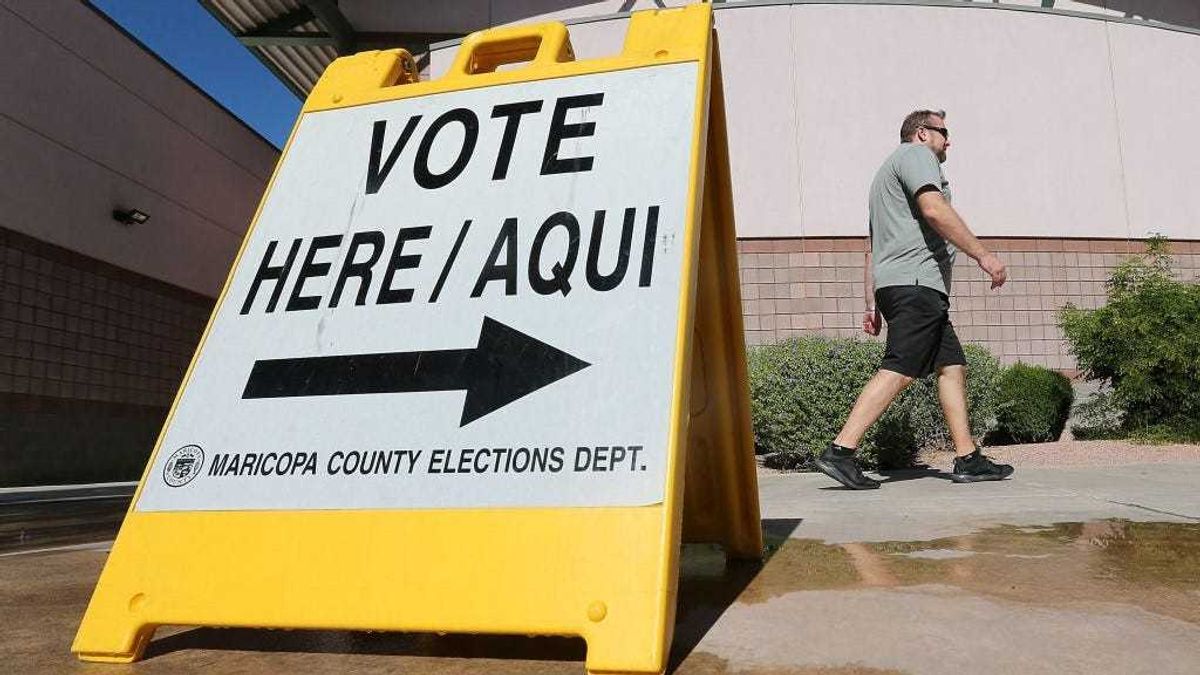 Arizona voters make their way to a polling place to cast their ballot during the midterm elections on November 6, 2018 in Phoenix, Arizona.