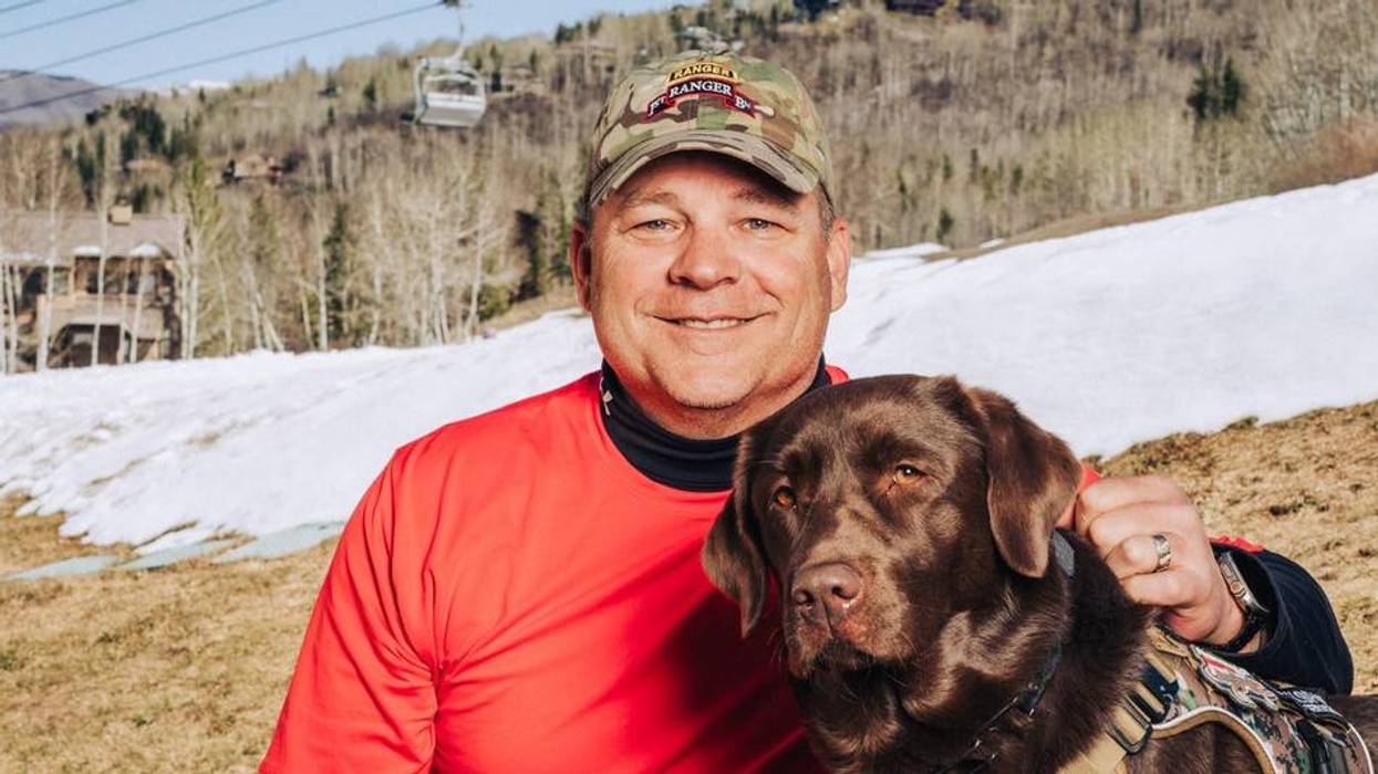 Army veteran Brent South poses with Shady Sadie on the slopes of Snowmass in Colorado at the 40th National Disabled Veterans Winter Sports Clinic, April 2026.