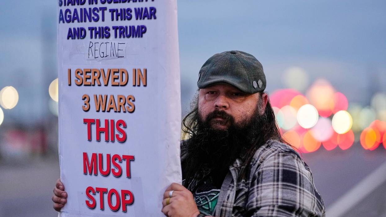 Army veteran Christopher William McFarland protests the war in Iran on Monday, March 2, 2026, in Clarksville, Tenn.
