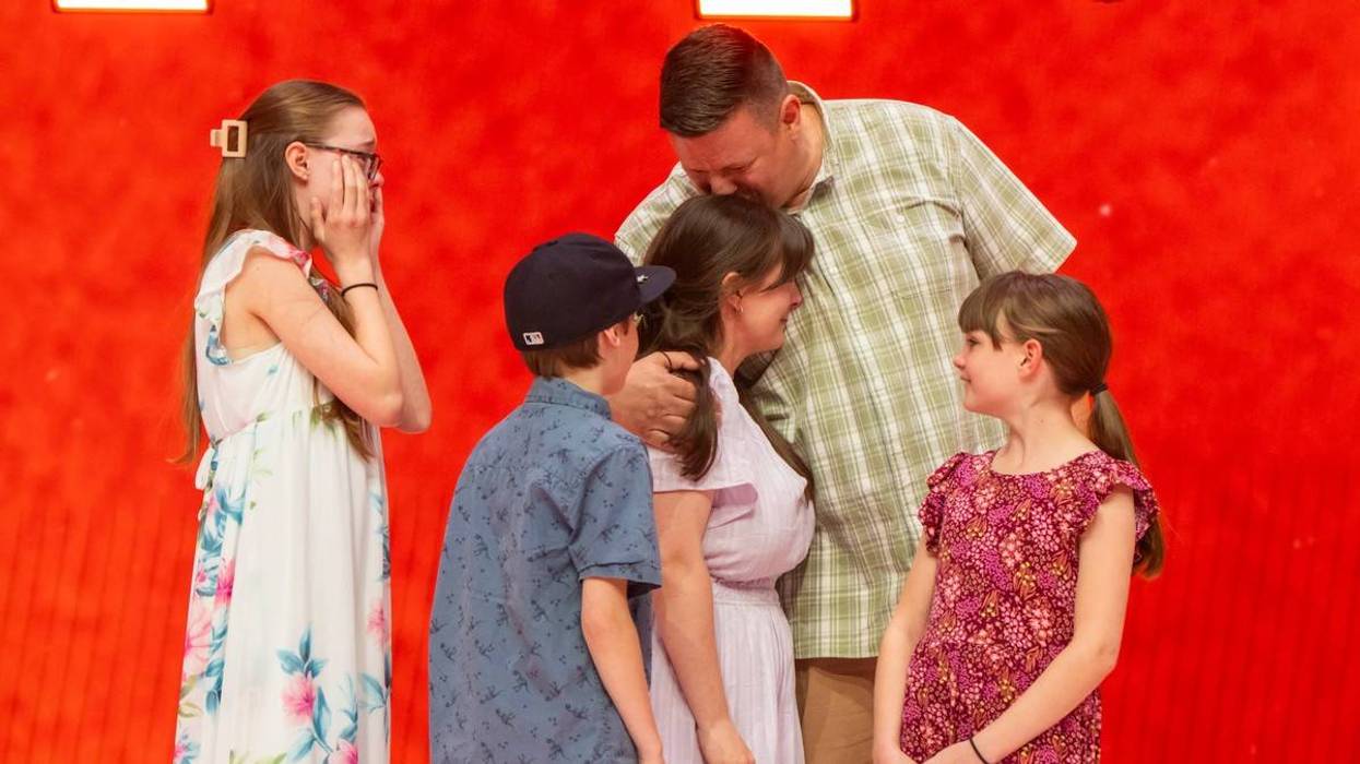 Army veteran John Pomelow and his family react after having their mortgage paid off by the Home Depot Foundation.