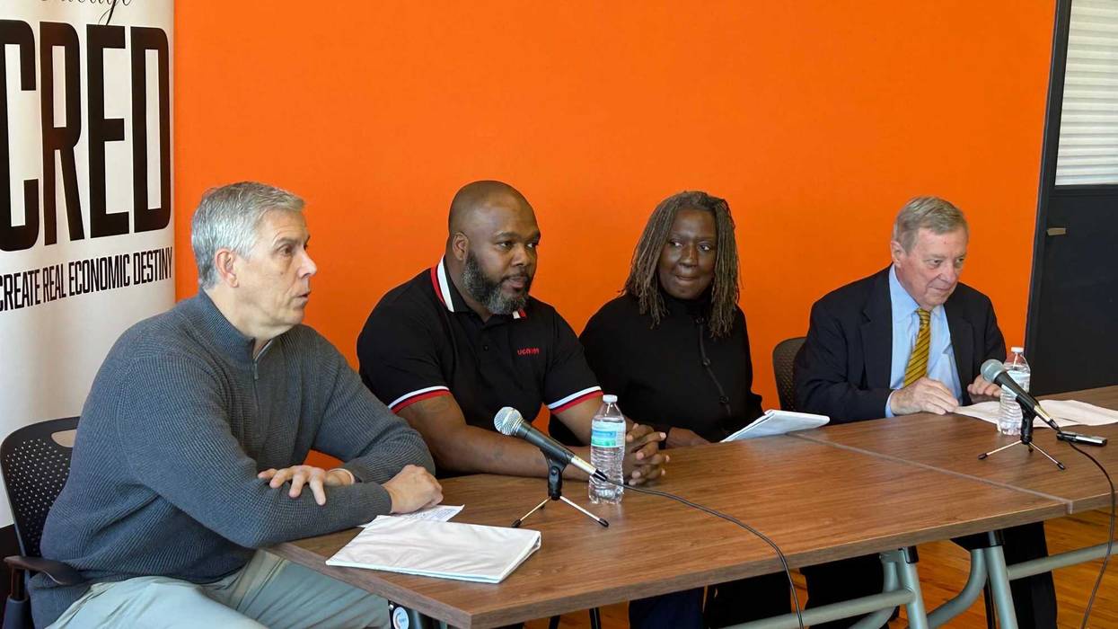 Arne Duncan, left, was among those who spoke to reporters on Tuesday about a new, nearly $4 million grant that's been awarded to the anti-violence organization Chicago CRED.
