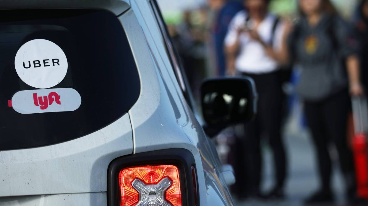 Arriving passengers wait to board Uber vehicles at the new 'LAX-it' ride-hail passenger pickup lot at Los Angeles International Airport (LAX) on November 6, 2019 in Los Angeles, California.
