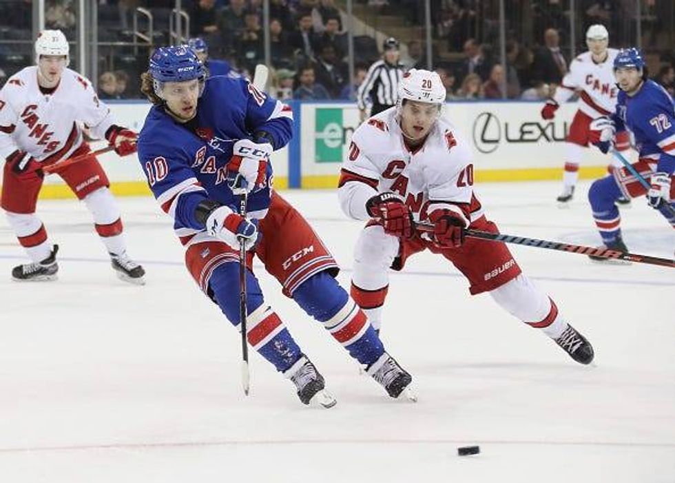 Artemi Panarin chases down the puck for the Rangers.
