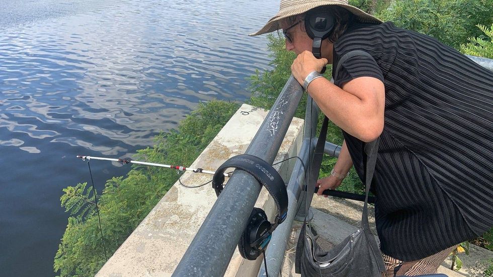 Artist Liz Campbell along the Schuylkill River at part of the Academy of Natural Sciences at Drexel University