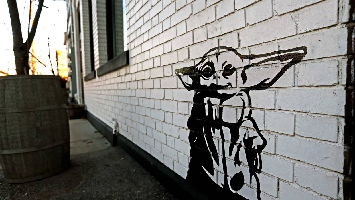 Artist Michael Cerda painted a baby Yoda onto Hotel Madrid in Walker's Point.