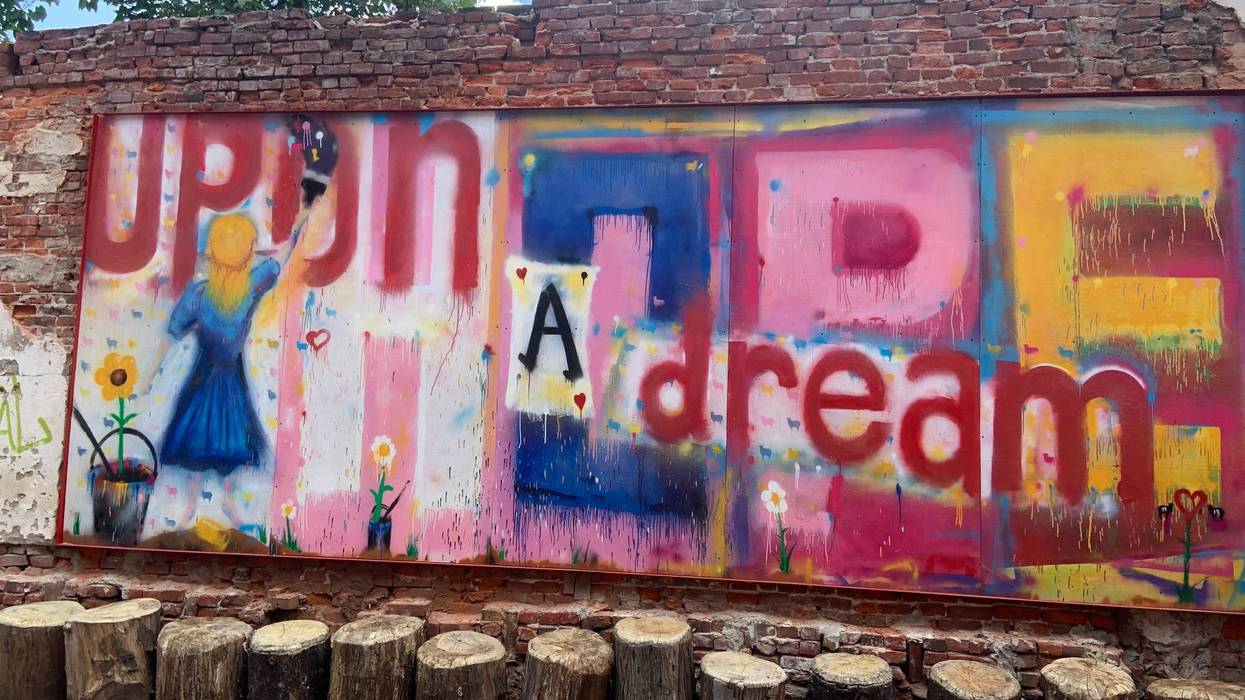 Artist Victor Sgro says his 8-foot by 20-foot mural is meant to convey the pain of addiction and his hope for the future.