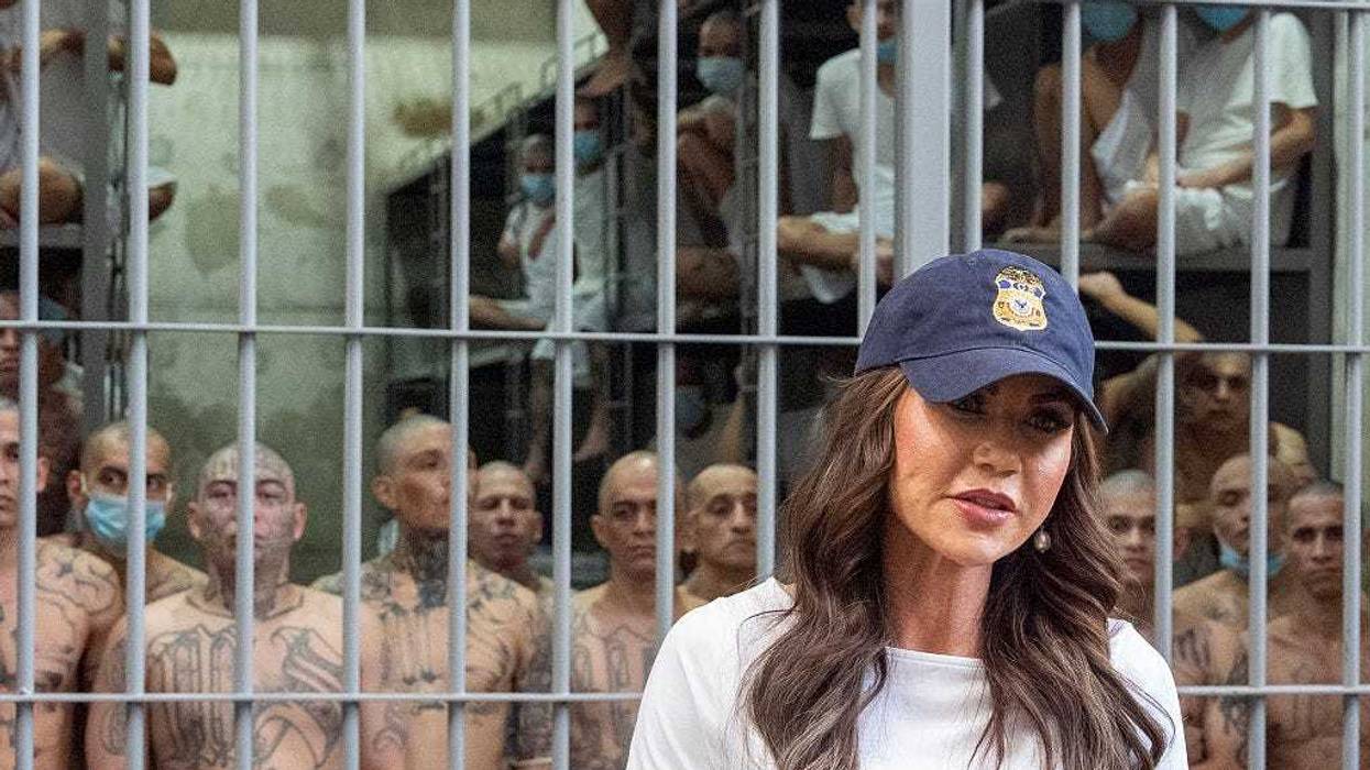 As prisoners stand looking out from a cell, Department of Homeland Security Secretary Kristi Noem speaks during a tour of the Terrorist Confinement Center (CECOT) on March 26, 2025 in Tecoluca, El Salvador. CBS News' “60 Minutes” on Sunday didn't air a planned story on Trump administration deportations of immigrants to El Salvador, pulling it only hours before airtime at the direction of new editor-in-chief Bari Weiss.