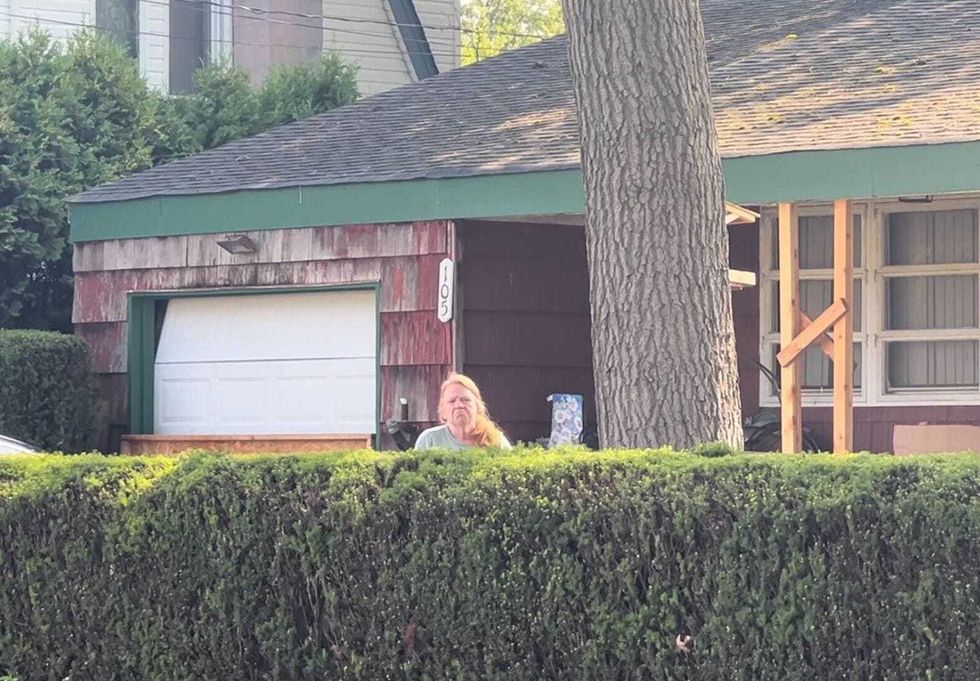 Asa Ellerup, 59, the estranged wife of Gilgo Beach serial killer suspect Rex Heuermann, stands outside the family