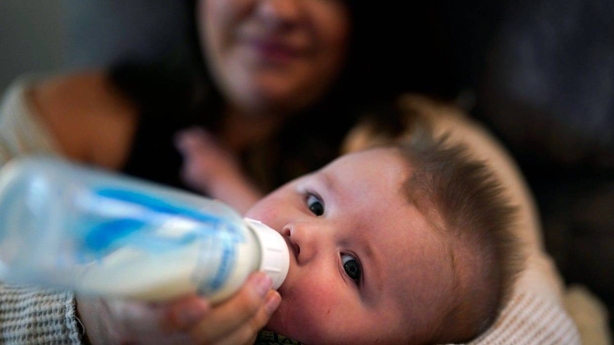 Ashley Maddox feeds her 5-month-old son, Cole, with formula she bought through a Facebook group of mothers in need Thursday, May 12, 2022, in Imperial Beach, Calif.