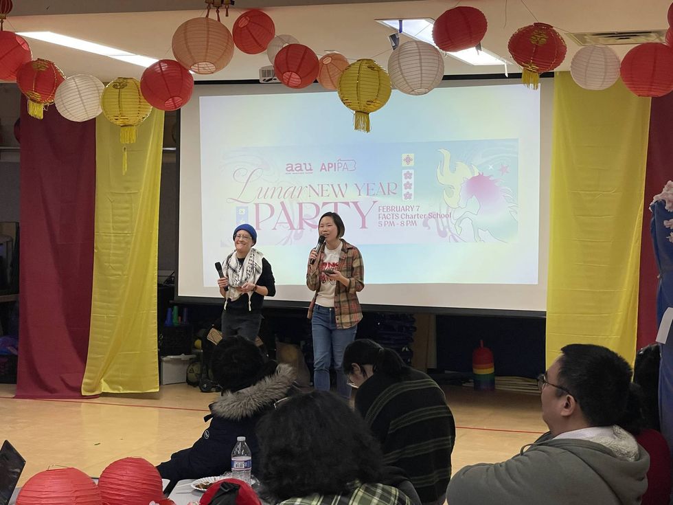 Asian Americans United Executive Director Vivian Chang speaks to the crowd at FACTS Charter School on Saturday, Feb. 7.