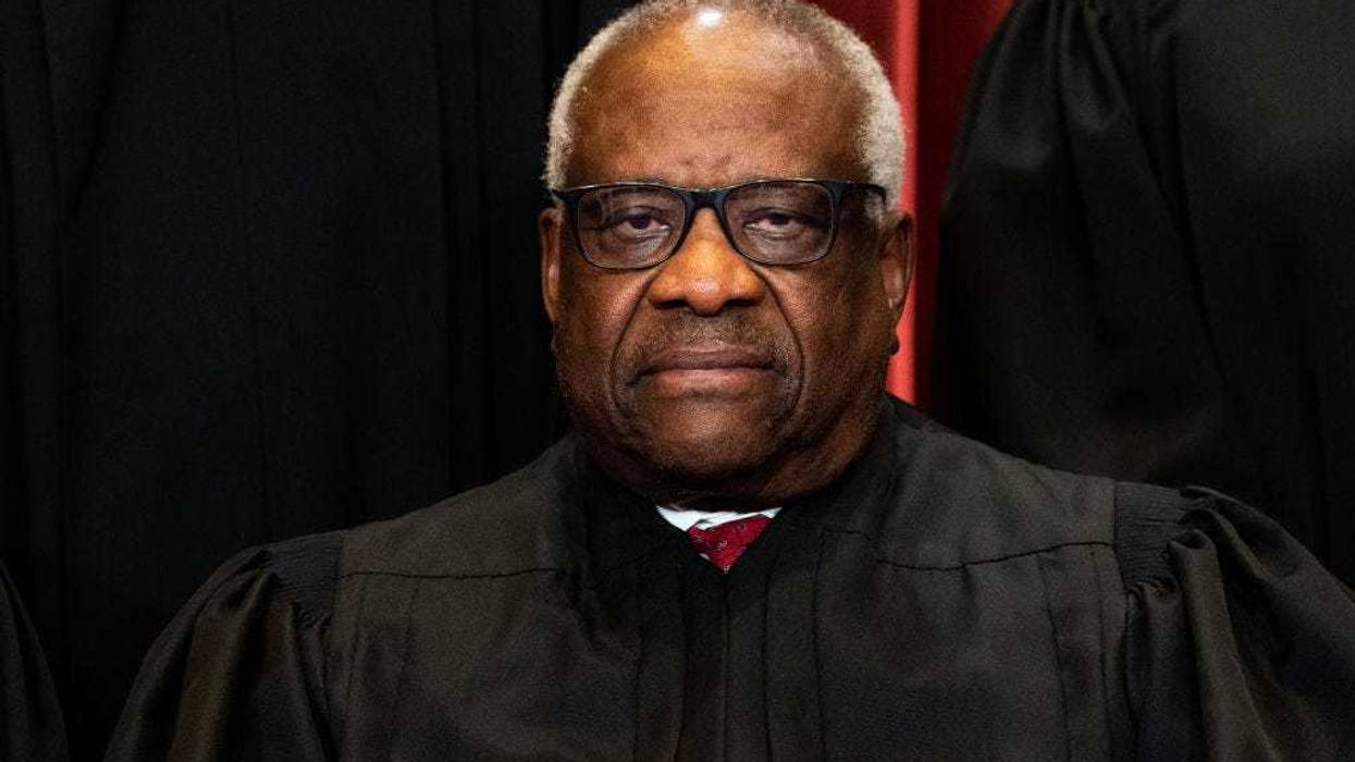 Associate Justice Clarence Thomas sits during a group photo of the Justices at the Supreme Court in Washington, DC on April 23, 2021. (Photo by Erin Schaff-Pool/Getty Images)