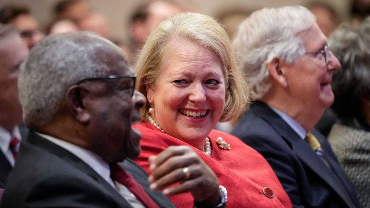 Associate Supreme Court Justice Clarence Thomas sits with his wife and conservative activist Virginia Thomas while he waits to speak at the Heritage Foundation on October 21, 2021 in Washington, DC. Clarence Thomas has now served on the Supreme Court for 30 years. He was nominated by former President George H. W. Bush in 1991 and is the second African-American to serve on the high court, following Justice Thurgood Marshall. (Photo by Drew Angerer/Getty Images)