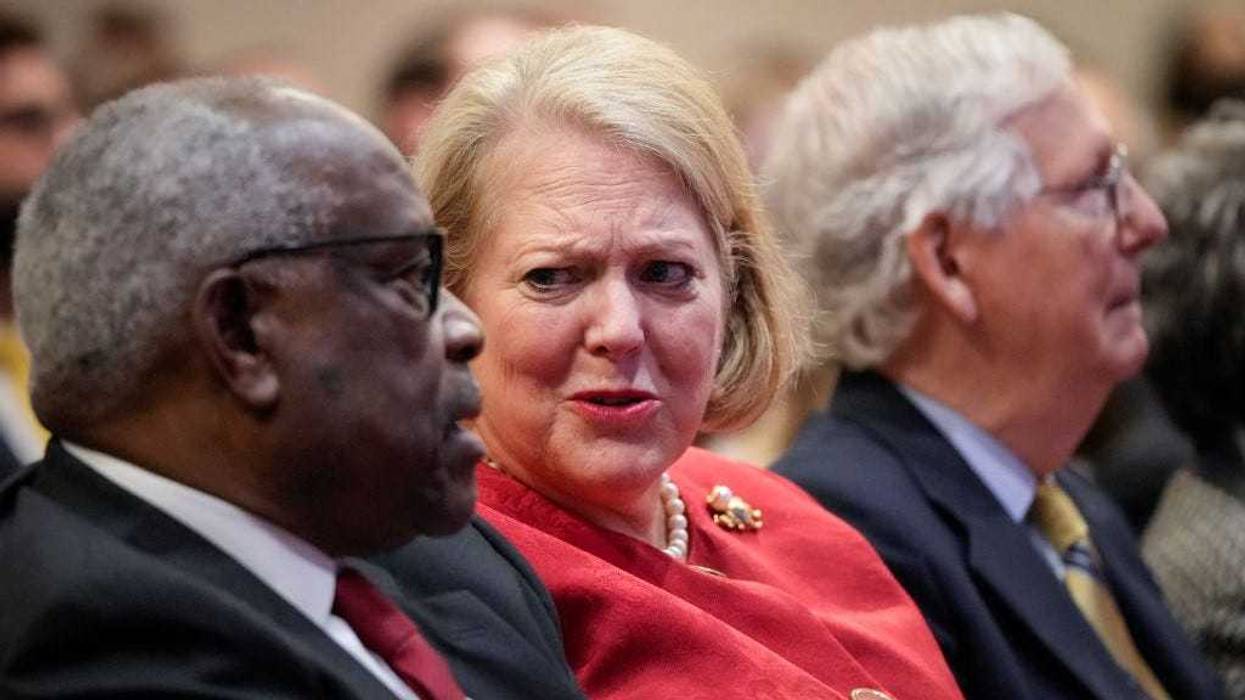Associate Supreme Court Justice Clarence Thomas sits with his wife and conservative activist Virginia Thomas while he waits to speak at the Heritage Foundation on October 21, 2021 in Washington, DC.