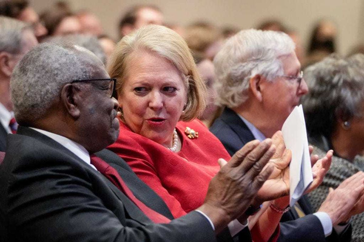 Associate Supreme Court Justice Clarence Thomas sits with his wife and conservative activist Virginia Thomas while he waits to speak at the Heritage Foundation on October 21, 2021 in Washington, DC. Clarence Thomas has now served on the Supreme Court for 30 years. He was nominated by former President George H. W. Bush in 1991 and is the second African-American to serve on the high court, following Justice Thurgood Marshall. (Photo by Drew Angerer/Getty Images)