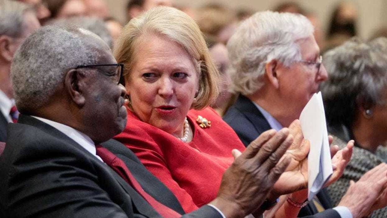 Associate Supreme Court Justice Clarence Thomas sits with his wife and conservative activist Virginia Thomas while he waits to speak at the Heritage Foundation on October 21, 2021 in Washington, DC. Clarence Thomas has now served on the Supreme Court for 30 years. He was nominated by former President George H. W. Bush in 1991 and is the second African-American to serve on the high court, following Justice Thurgood Marshall. (Photo by Drew Angerer/Getty Images)