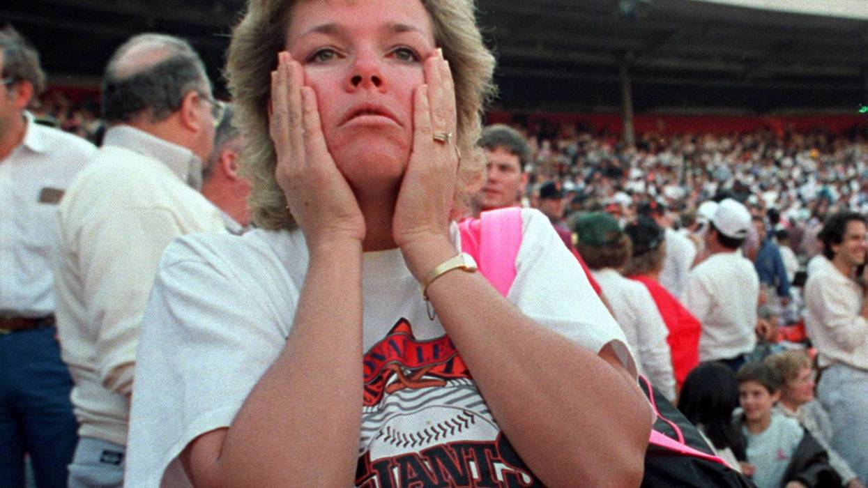 At Candlestick Park, the World Series was suddenly forgotten. A fan reacts to the shaking at the park in October 1989 just after the Loma Prieta earthquake.