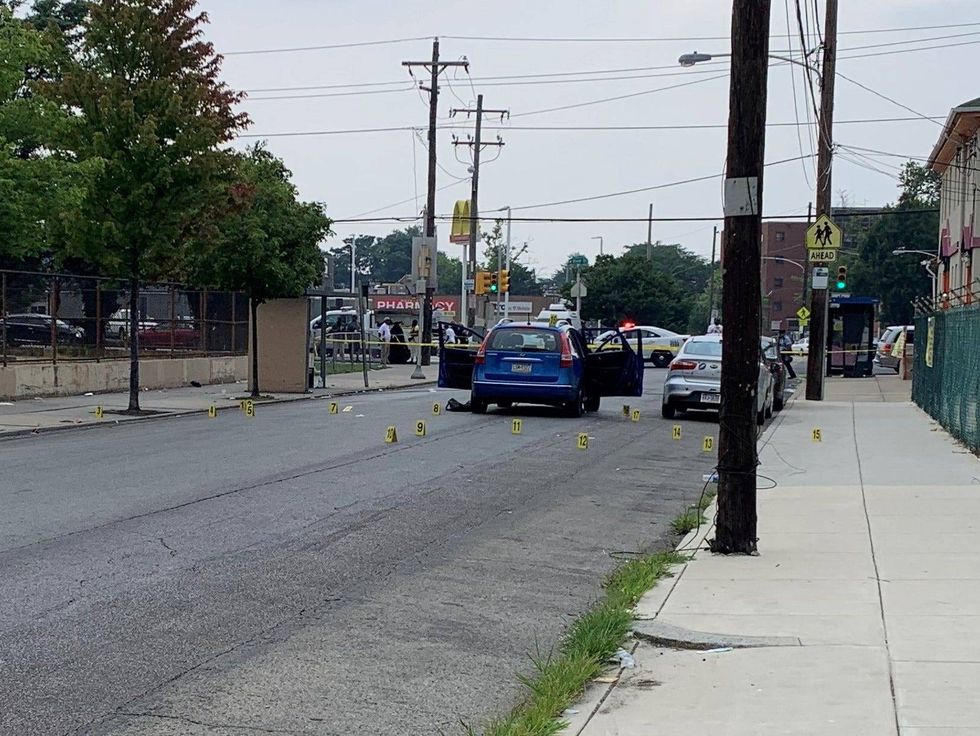 At least 17 pieces of evidence marked at the scene of a triple shooting where two teenagers were killed.