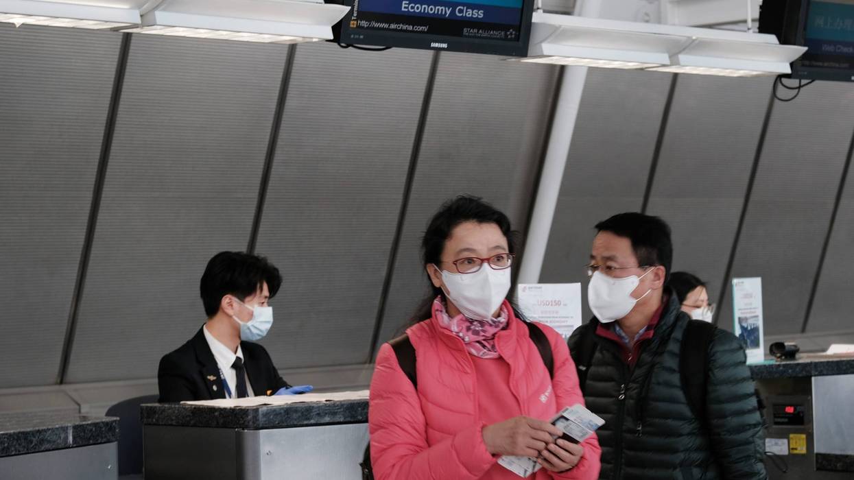 At the terminal that serves planes bound for China, people wear medical masks at John F. Kennedy Airport (JFK) out of concern over the Coronavirus on January 31, 2020 in New York City.