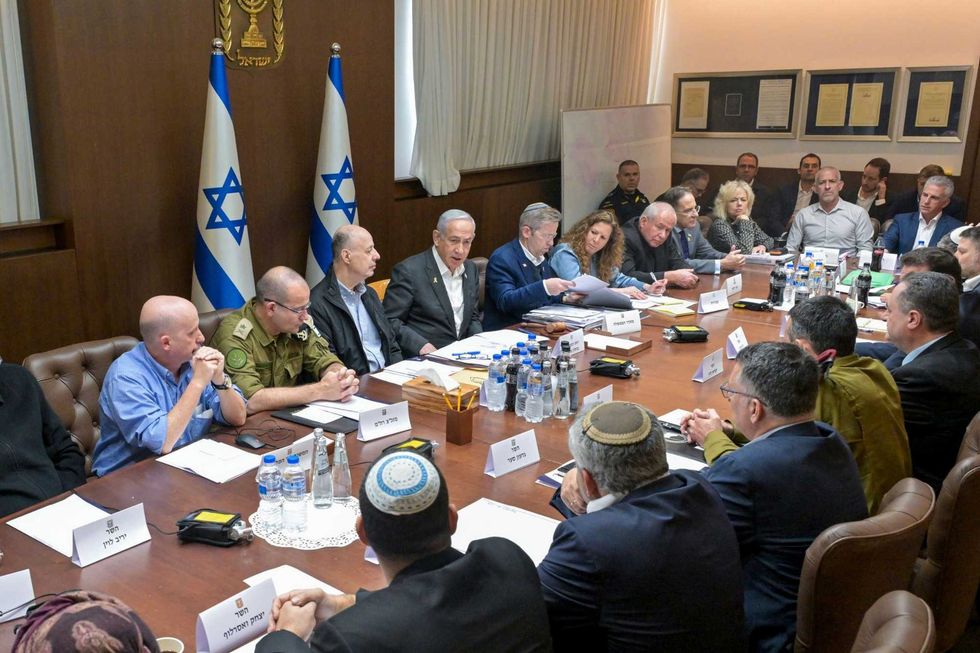 aThis photo provided by the Israeli Government Press Office, Israeli Prime Minister Benjamin Netanyahu, center, convened his security Cabinet to vote on a ceasefire deal after confirming an agreement had been reached that would pause the 15-month war with Hamas in Gaza, in Jerusalem, Friday, Jan. 17, 2025