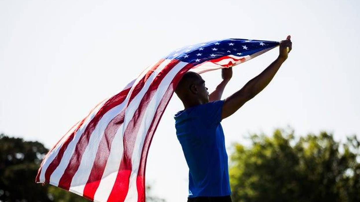 Athlete holding an American flag