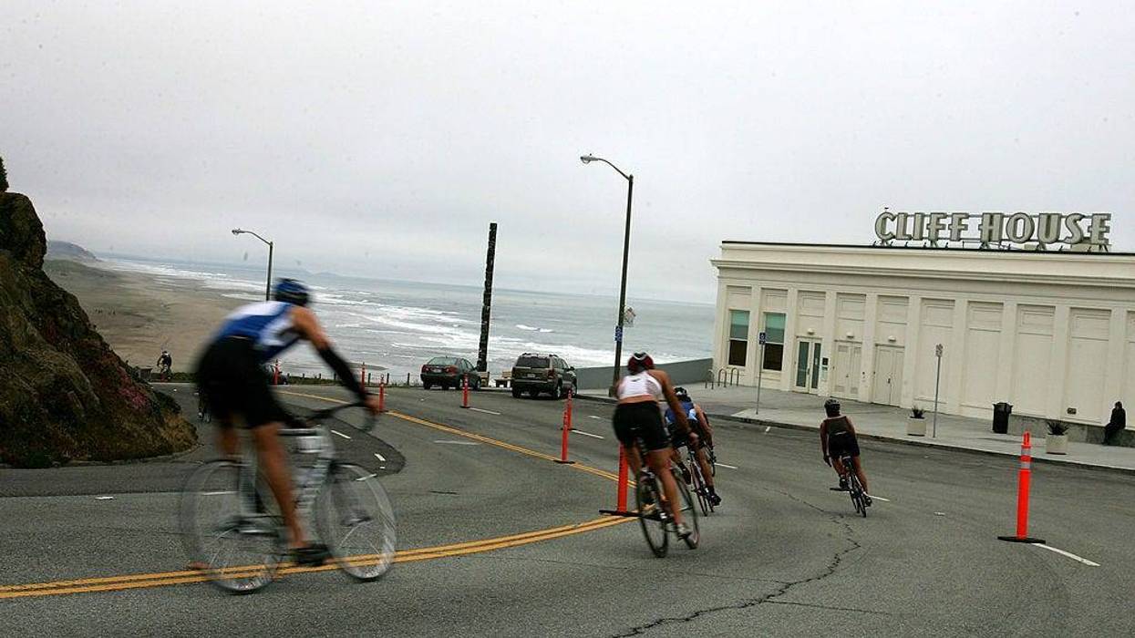 Athletes race down the Great Highway during the bike portion of the Escape from Alcatraz Triathlon on June 3, 2007 in San Francisco, California.