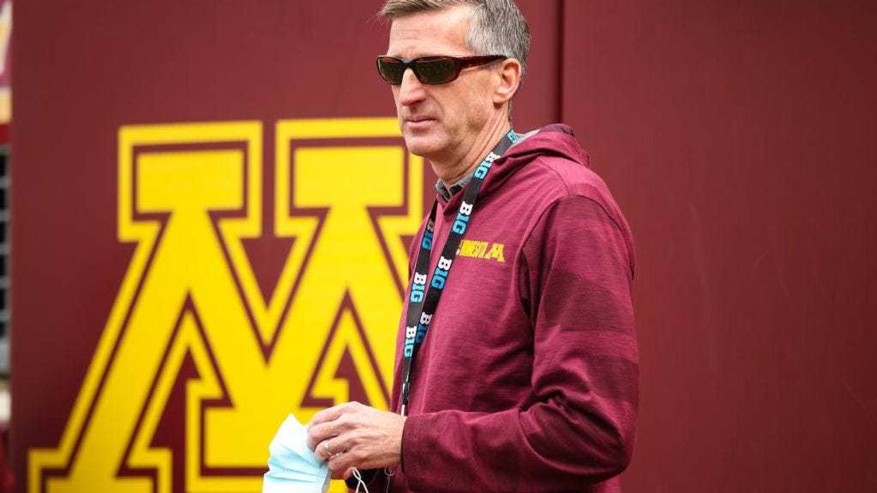 Athletic director Mark Coyle of the Minnesota Golden Gophers looks on at a football game at Huntington Bank Stadium.