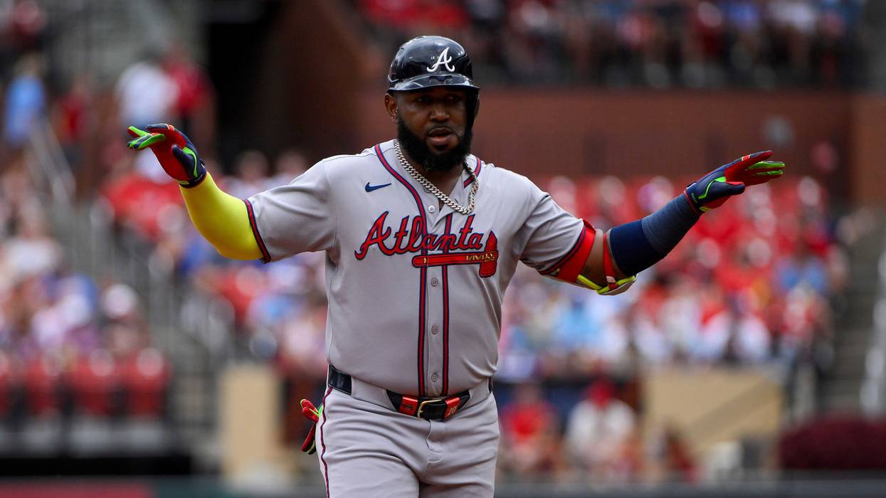 Atlanta Braves designated hitter Marcell Ozuna (20) reacts as he runs the bases after hitting a solo home run against the St. Louis Cardinals during the second inning at Busch Stadium.