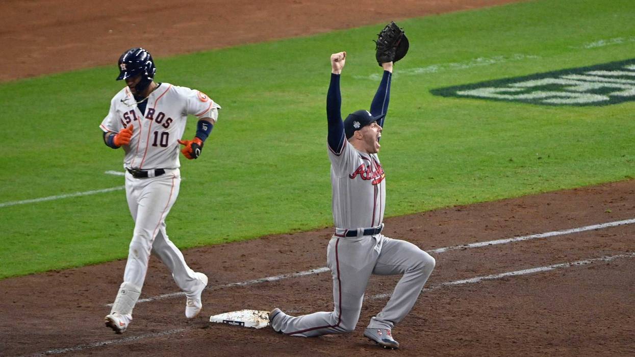 Atlanta Braves first baseman Freddie Freeman (5) celebrates after forcing out Houston Astros first baseman Yuli Gurriel (10) for the final out during game six of the 2021 World Series at Minute Maid Park.
