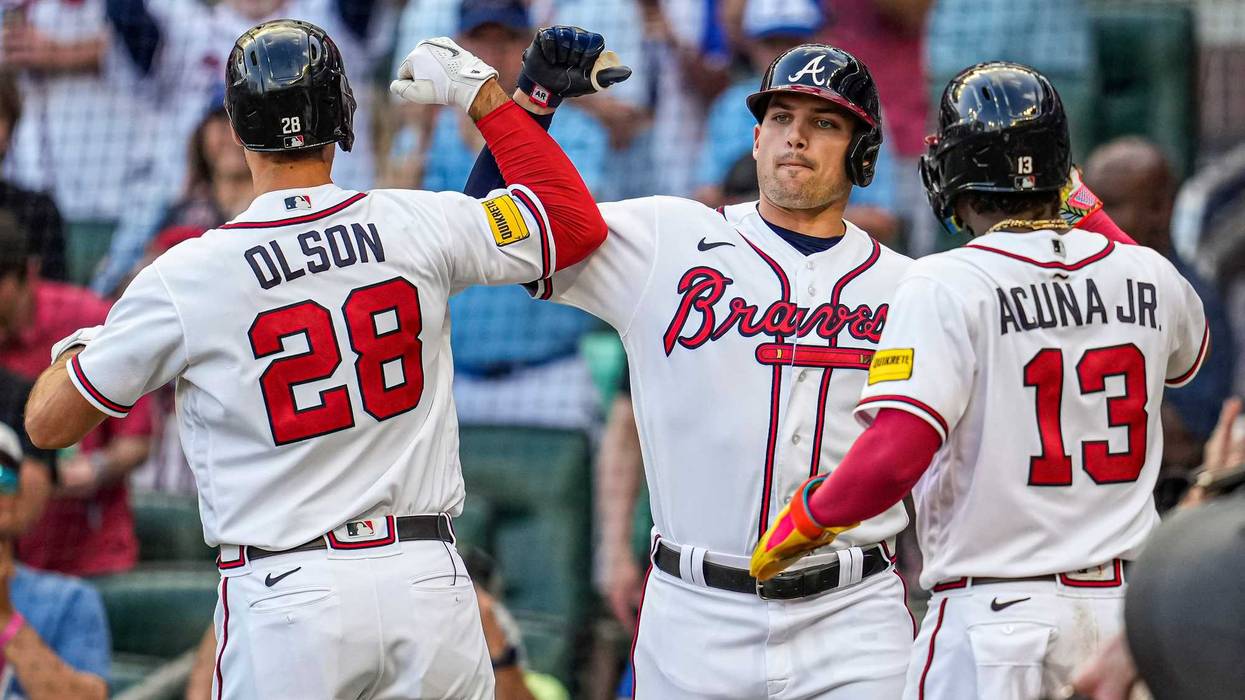 Atlanta Braves first baseman Matt Olson (28) reacts with third baseman Austin Riley (27) and right fielder Ronald Acuna Jr. (13) after hitting a home run against the Philadelphia Phillies