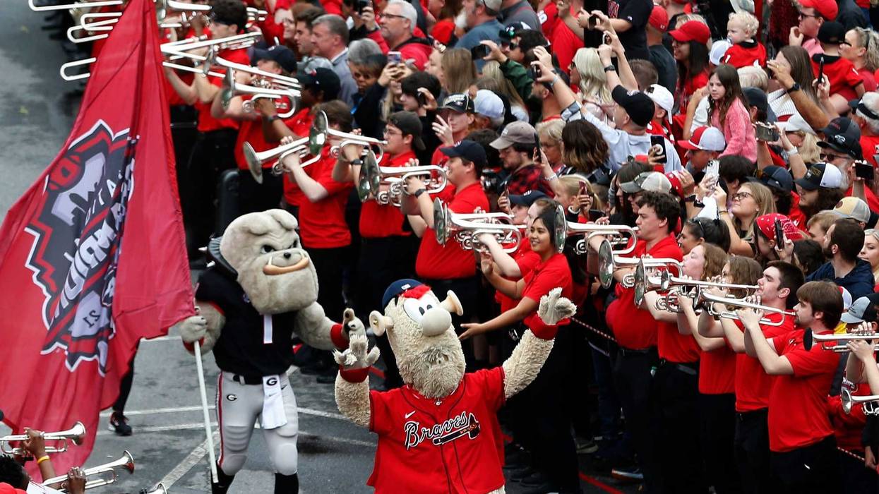 Atlanta Braves mascot Blooper and Georgia mascot Hairy Dawg fire up fans at the Dawg Walk before the start of the G-Day spring football game in Athens, Ga., on Saturday, April 16, 2022.