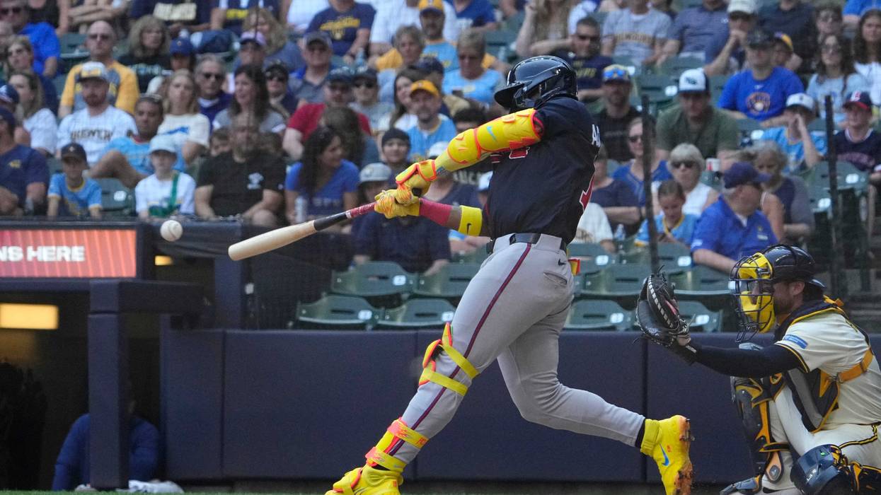 Atlanta Braves outfielder Ronald Acuna Jr. (13) singles against the Milwaukee Brewers in the eighth inning at American Family Field.