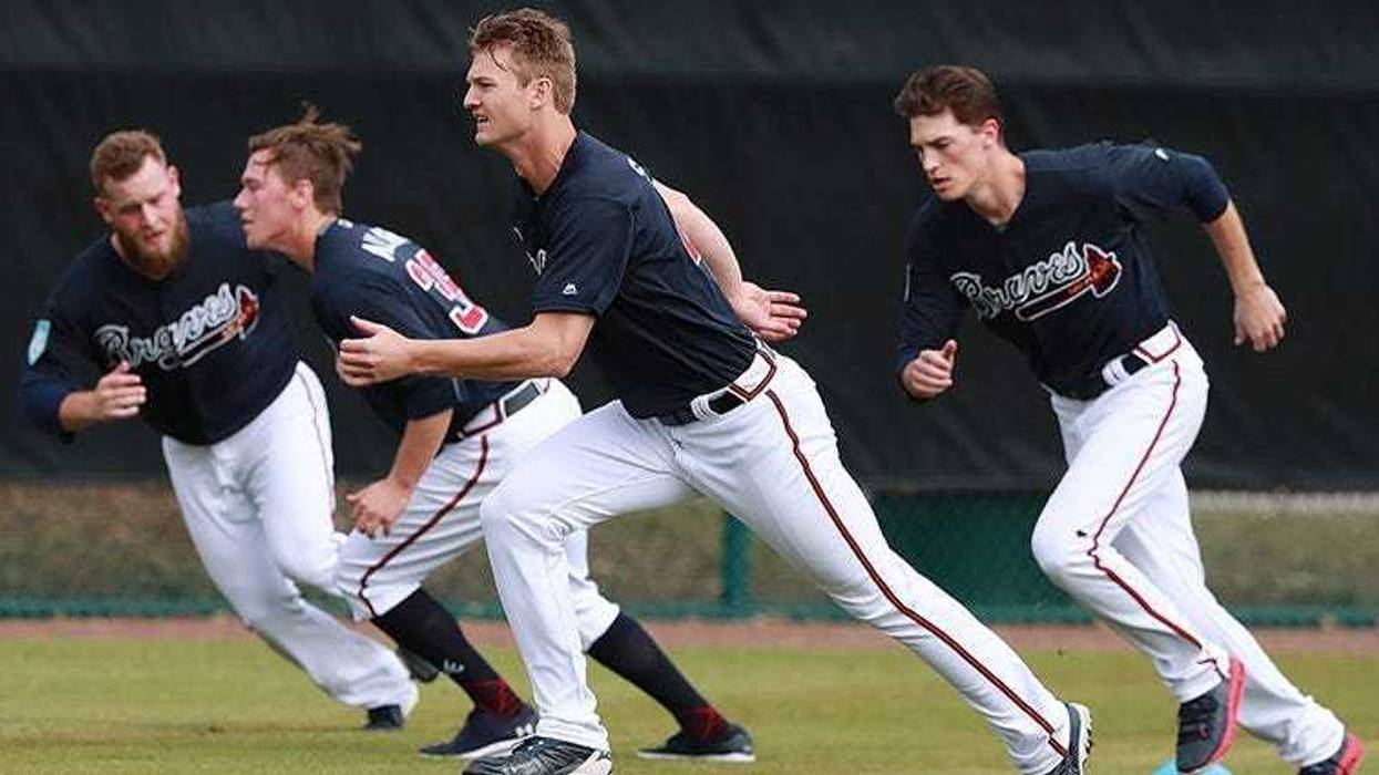 Atlanta Braves pitchers, from left, A. J Minter, Kolby Allard, Mike Soroka, and Max Fried run sprints