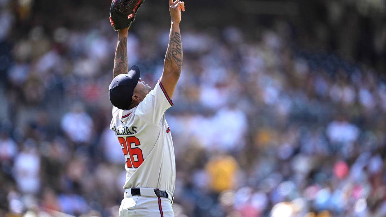 Atlanta Braves relief pitcher Raisel Iglesias (26) celebrates on the field after defeating the San Diego Padres at Petco Park