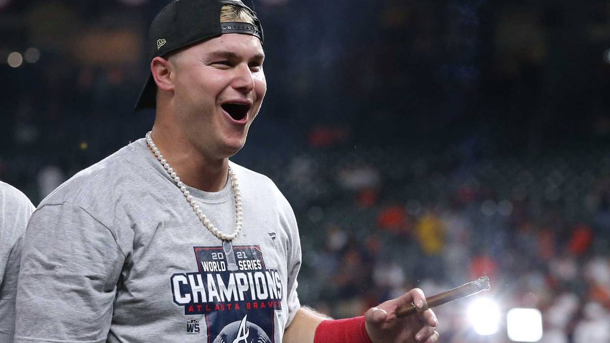 Atlanta Braves right fielder Joc Pederson celebrates with a cigar after defeating the Houston Astros in game six of the 2021 World Series at Minute Maid Park.