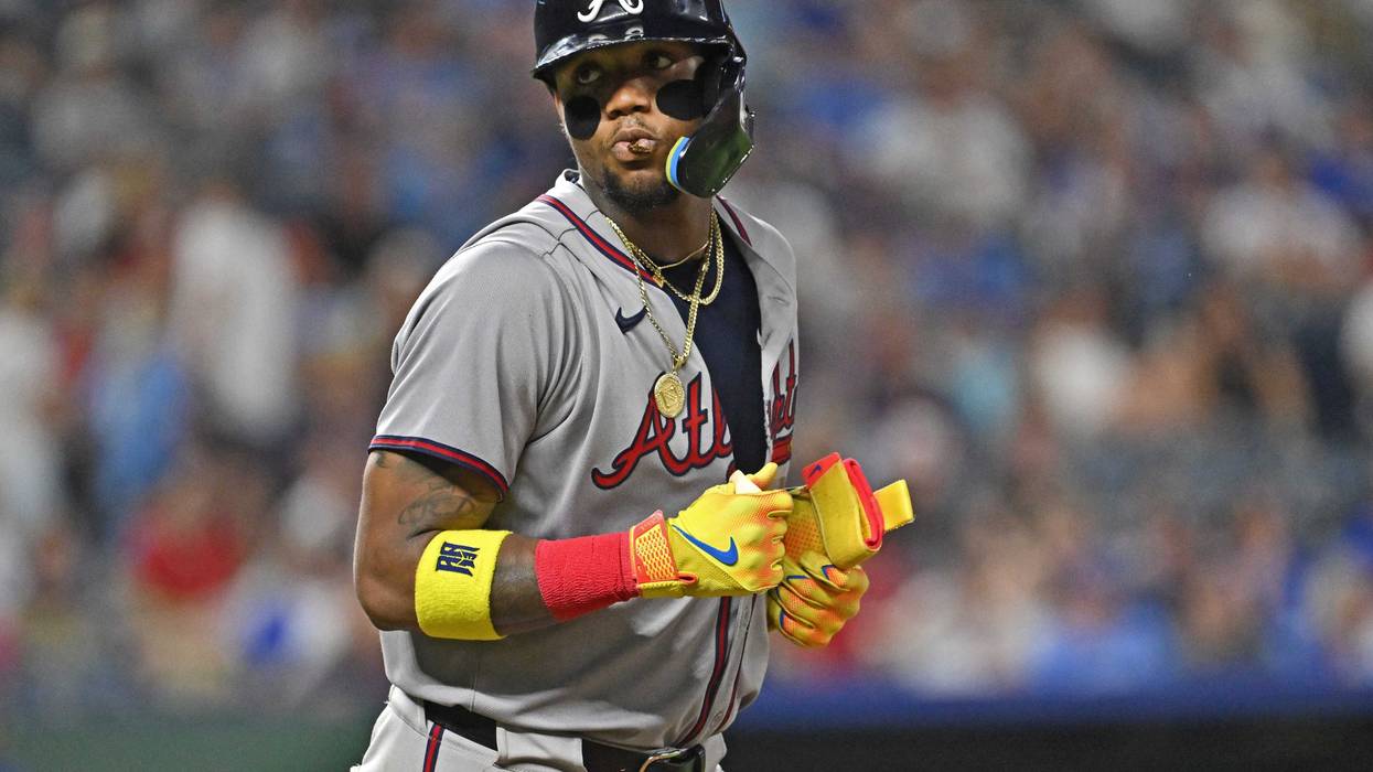 Atlanta Braves right fielder Ronald Acuna Jr. (13) looks toward the Kansas City Royals dugout after getting walked in the ninth inning at Kauffman Stadium.