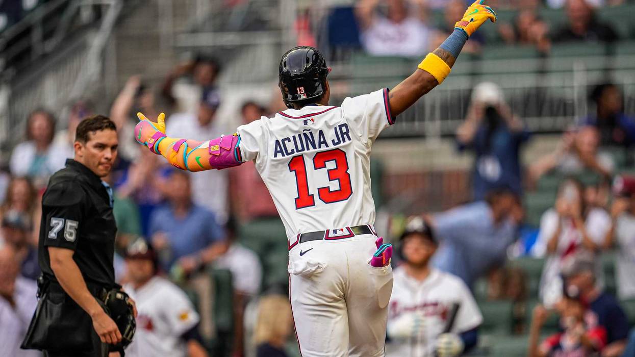 Atlanta Braves right fielder Ronald Acuna Jr (13) reacts after hitting a lead off home run against the New York Mets during the first inning at Truist Park.