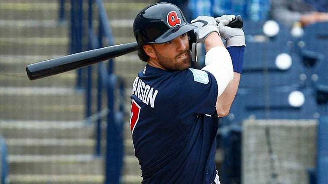 Atlanta Braves shortstop Dansby Swanson hits a single during the fourth inning of a game