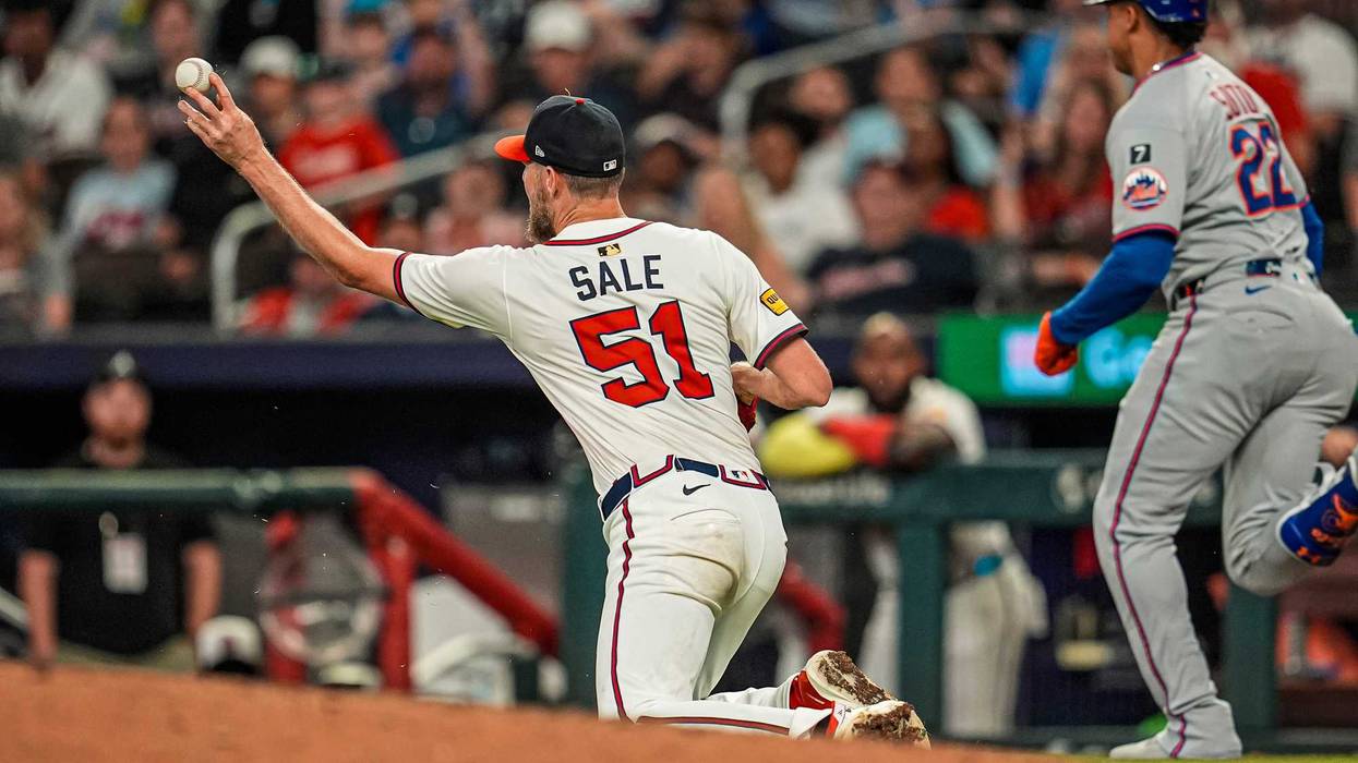 Atlanta Braves starting pitcher Chris Sale (51) throws out New York Mets right fielder Juan Soto (22) during the ninth inning at Truist Park.