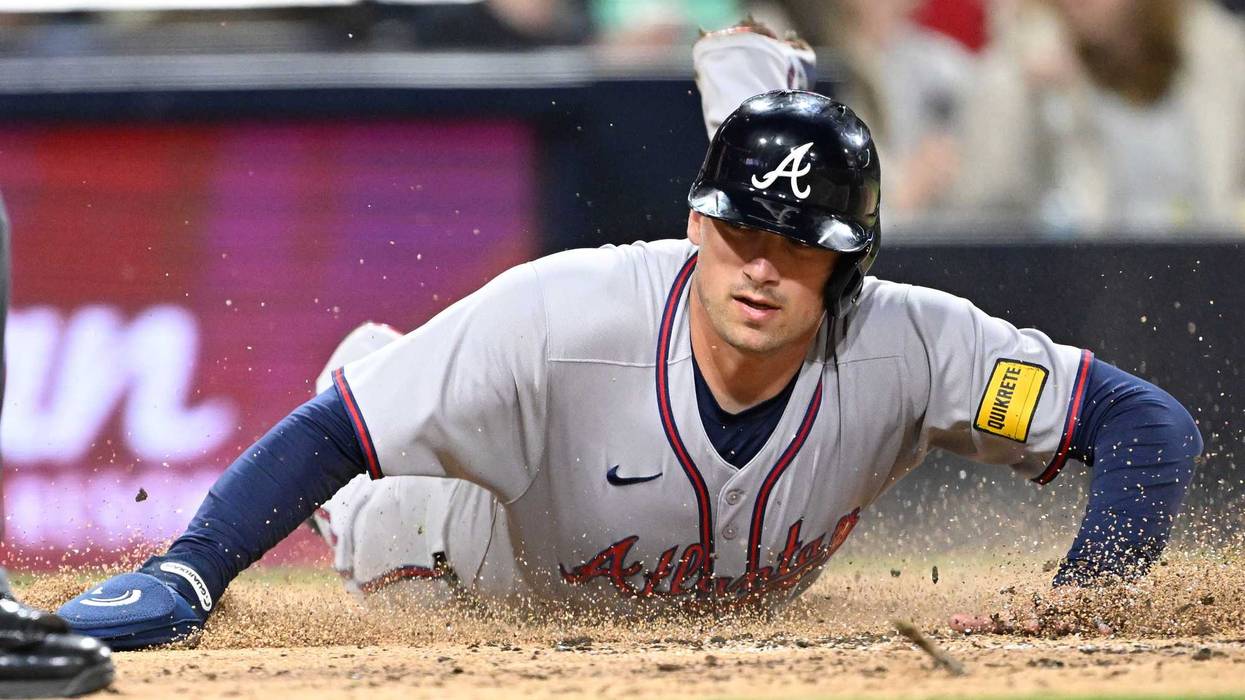 Atlanta Braves third baseman Austin Riley (27) slides as he scores during third inning against the San Diego Padres at Petco Park.