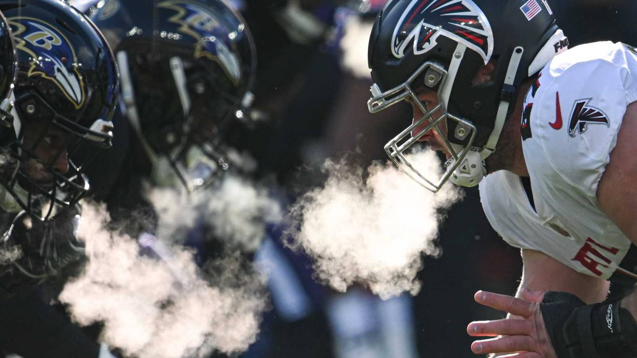 Atlanta Falcons center Drew Dalman (67) prepares to snap the ball during the first half against the Baltimore Ravens at M&T Bank Stadium.