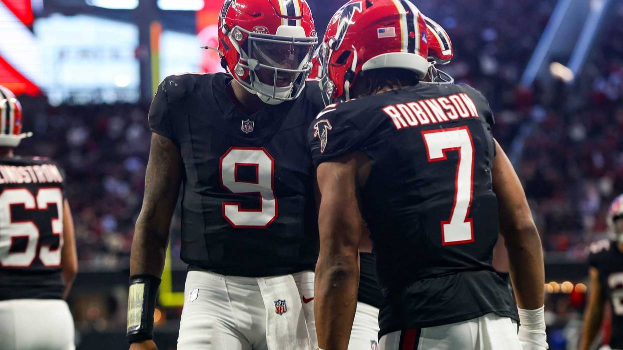 Atlanta Falcons running back Bijan Robinson (7) celebrates after a touchdown with quarterback Michael Penix Jr. (9) against the New York Giants in the second quarter at Mercedes-Benz Stadium.