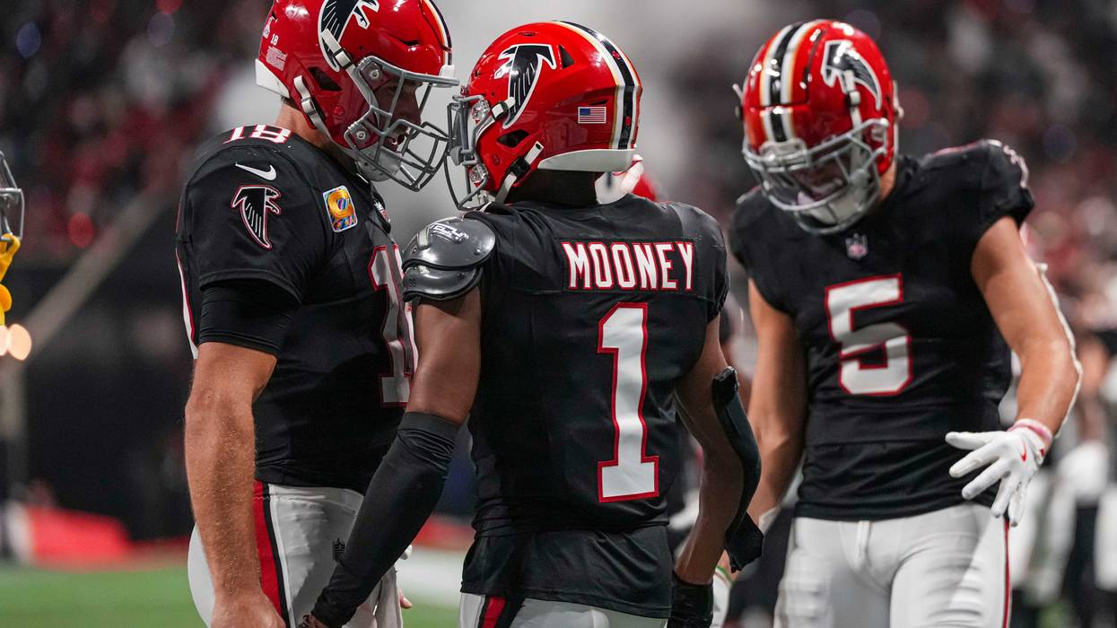 Atlanta Falcons wide receiver Darnell Mooney (1) reacts with quarterback Kirk Cousins (18) and wide receiver Drake London (5) after scoring a touchdown against the Tampa Bay Buccaneers