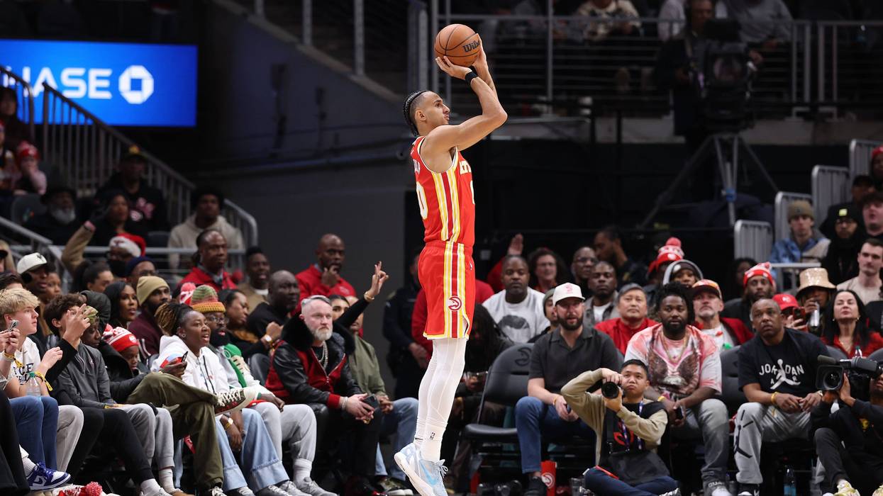 ATLANTA, GEORGIA - DECEMBER 23: Zaccharie Risacher #10 of the Atlanta Hawks shoots a three-point basket against the Chicago Bulls during the fourth quarter at State Farm Arena on December 23, 2025 in Atlanta, Georgia