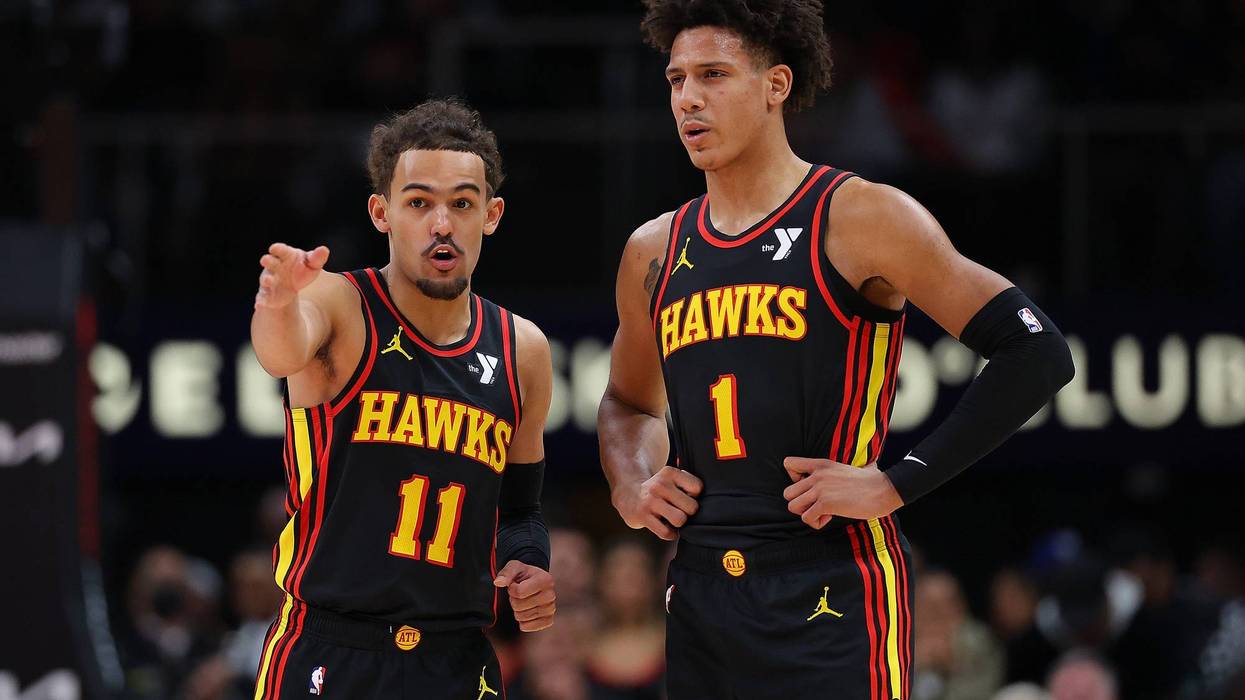 ATLANTA, GEORGIA - FEBRUARY 05: Trae Young #11 and Jalen Johnson #1 of the Atlanta Hawks converse against the LA Clippers during the second quarter at State Farm Arena on February 05, 2024 in Atlanta, Georgia