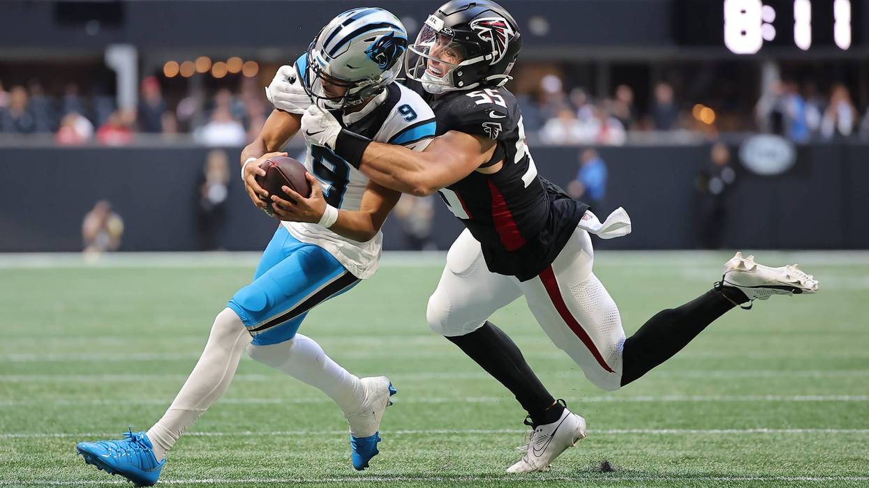 ATLANTA, GEORGIA - NOVEMBER 16: Bryce Young #9 of the Carolina Panthers is tackled by Kaden Elliss #55 of the Atlanta Falcons during the third quarter at Mercedes-Benz Stadium on November 16, 2025 in Atlanta, Georgia