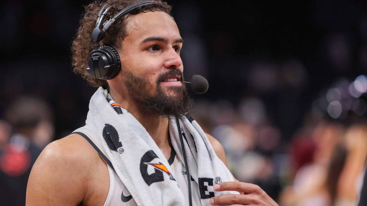 Atlanta Hawks guard Trae Young (11) does an interview after a victory against the Milwaukee Bucks