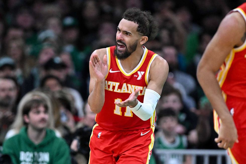 Atlanta Hawks guard Trae Young (11) reacts after scoring against the Boston Celtics during the fourth quarter at the TD Garden.