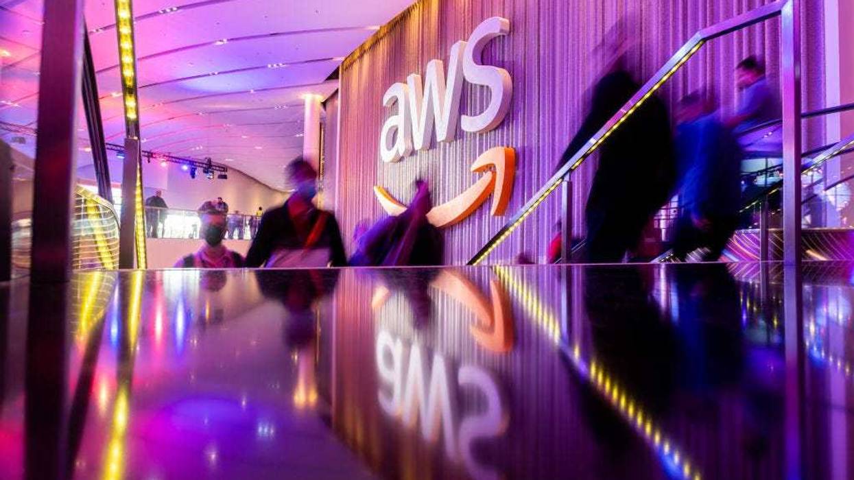 Attendees arrive during AWS re:Invent 2021, a conference hosted by Amazon Web Services, at The Venetian Las Vegas on November 30, 2021 in Las Vegas, Nevada. (Photo by Noah Berger/Getty Images for Amazon Web Services)