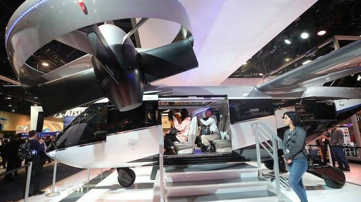 Attendees visit a full-scale mockup of the Bell Nexus 4EX air taxi concept at CES 2020 at the Las Vegas Convention Center on January 8, 2020 in Las Vegas, Nevada